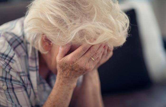 Senior woman in despair