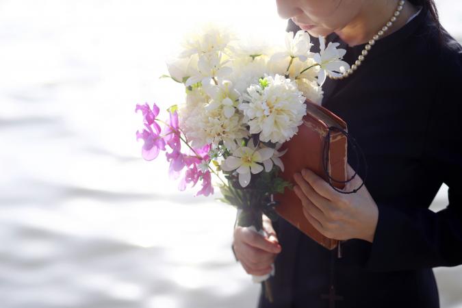 Woman reading a poem at a funeral