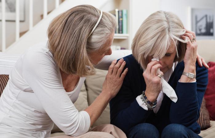 woman comforting crying friend