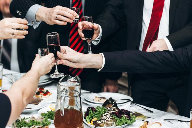 Man toasting at funeral reception