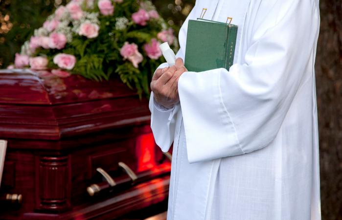 priest holding bible
