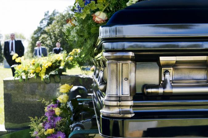Funeral procession in cemetery