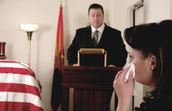 Man delivering eulogy speech