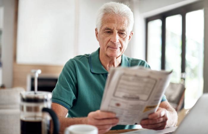 senior man reading the newspaper