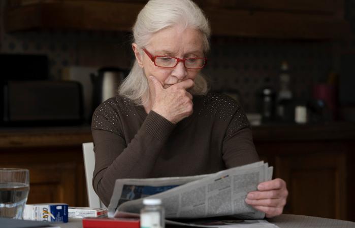 woman reading newspaper
