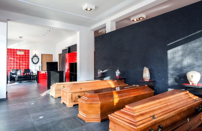 Coffins and urns in a funeral office