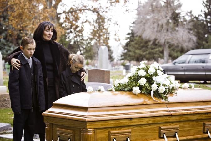Mother and two children at a funeral