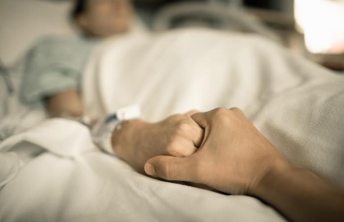 Man holding woman hand