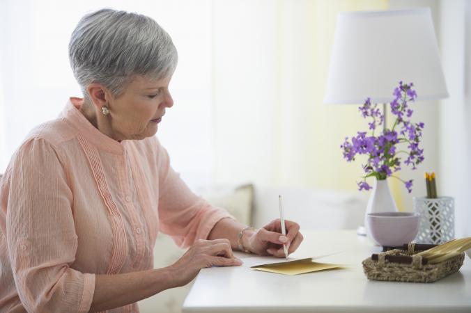 Woman writing sympathy card