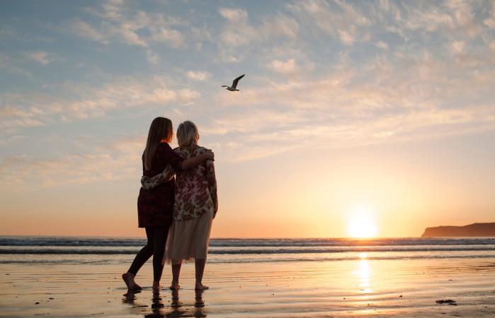 mother and daughter looking at view
