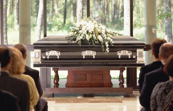 closed casket with flowers