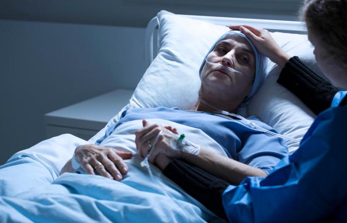 Volunteer supporting dying woman