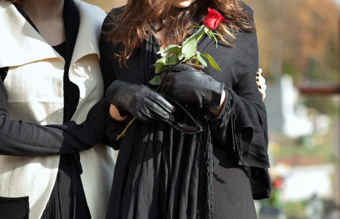 women at memorial service