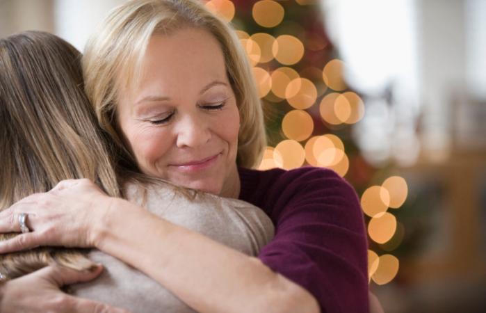 Mother and daughter hugging