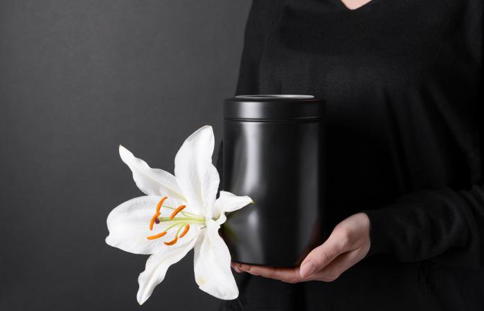 Woman with mortuary urn