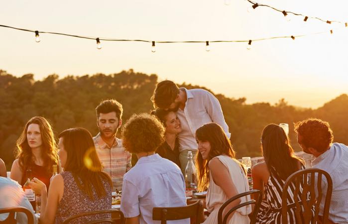 Friends enjoying reminiscing at funeral reception