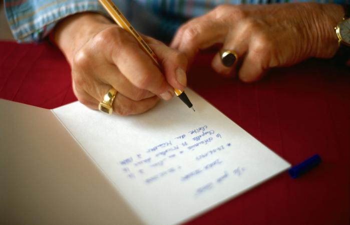 Woman writing thank-you note