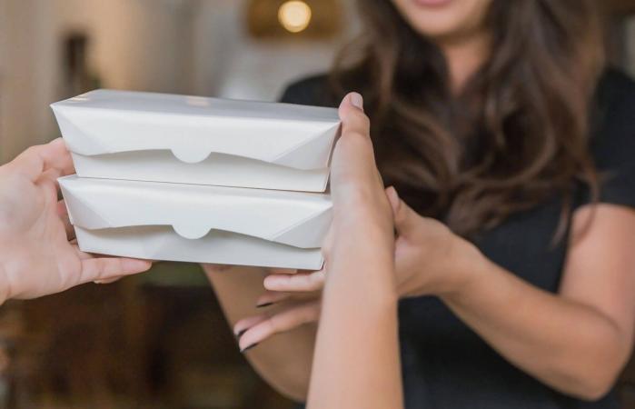 woman receiving food for funeral