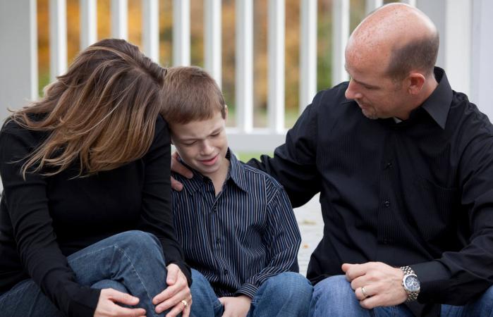 parents consoling child