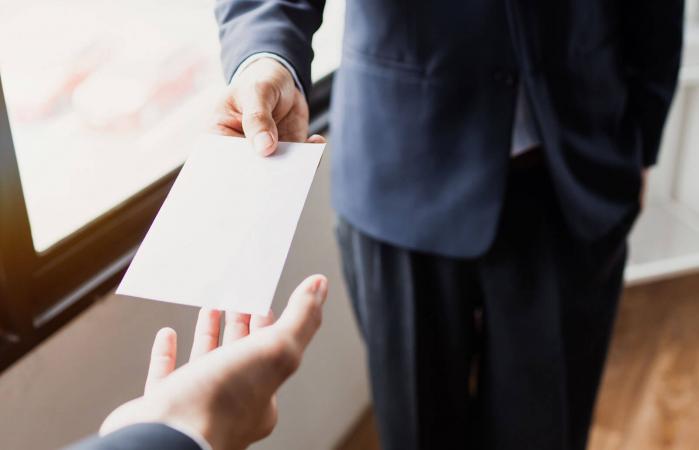 handing tip at funeral