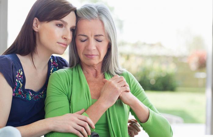 Woman consoling sad mother