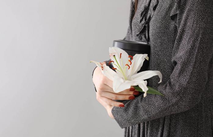 Woman with mortuary urn