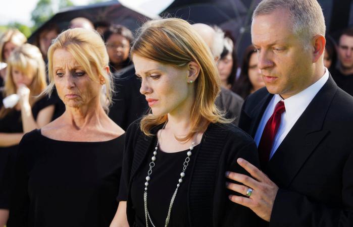 grieving family at a funeral