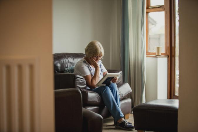 Grieving woman looking at a photo