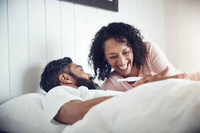 Happy couple after taking pregnancy test