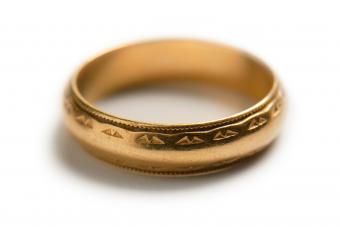Wedding band on white with soft shadow.