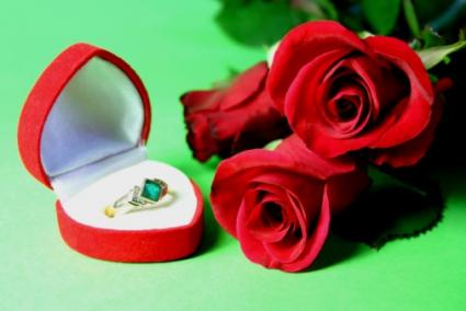Diamond ring with a ruby birthstones on each side