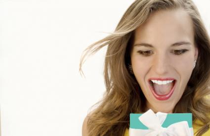 Excited woman holding a Tiffany gift box