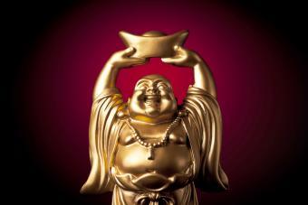 Golden, carved statue of the Buddha Maitreya