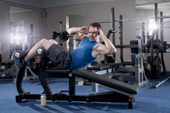 Man doing sit-ups on bench