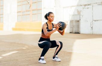 Woman With Medicine Ball Exercising