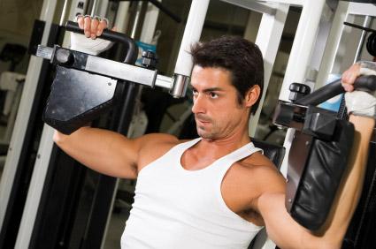 Guy working pec deck machine