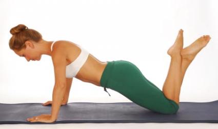 Girl doing Pilates exercise.