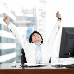 Man doing warm up stretches at his desk