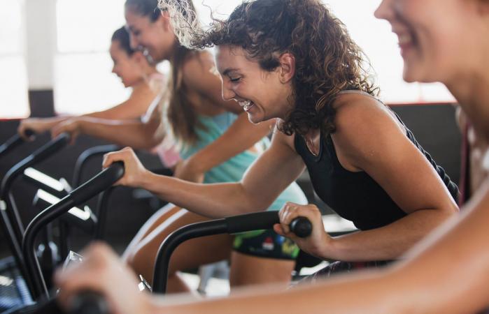 Woman using elliptical bike