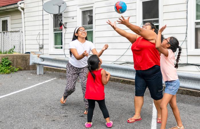 Family playing with a ball outdoor