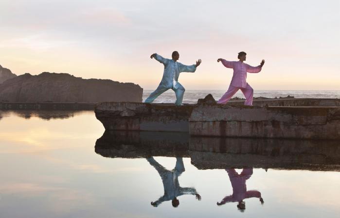 Man and woman practicing Tai Chi