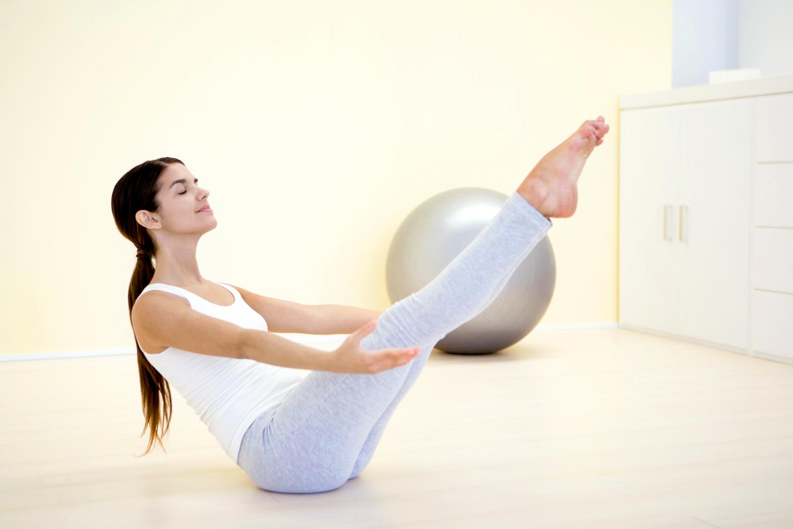 Woman performing boat pose