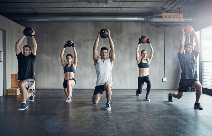 Group working out with medicine ball