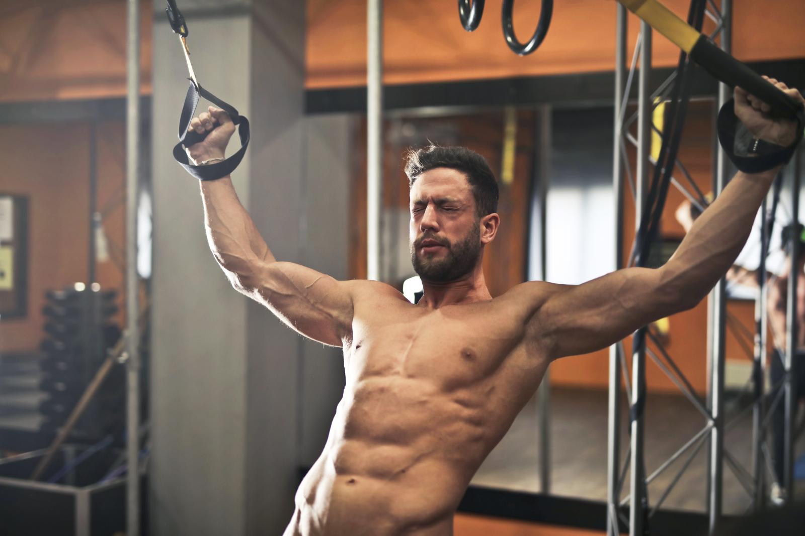 Strong man exercising naked
