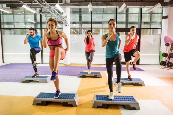 People in step aerobics class