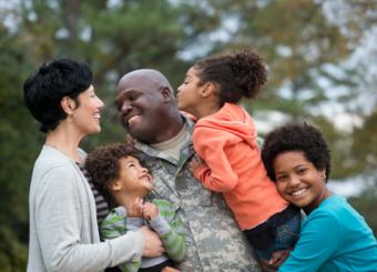 Family greeting returning soldier