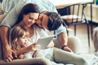 Happy young family having good time together