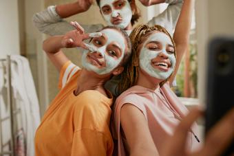 friends wearing cream masks