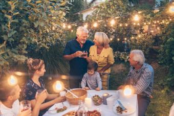 Senior couple celebrating their anniversary with family