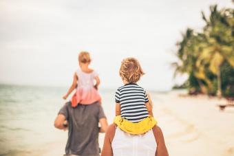 family walking by the sea